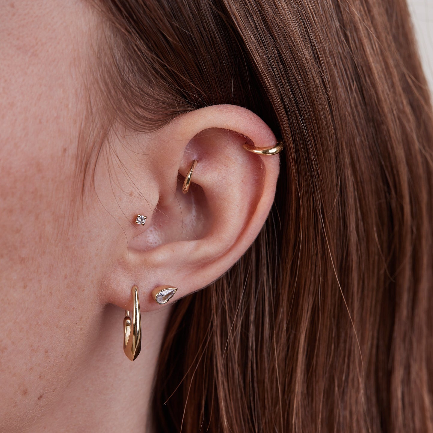 Piercing With a Drop Stone in a Gold Frame