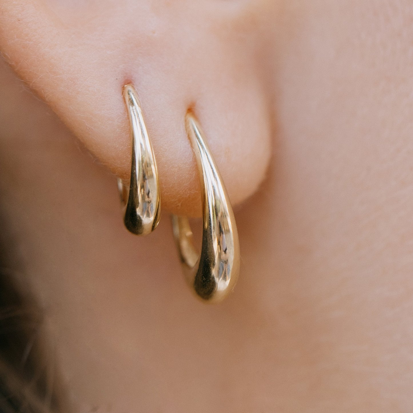 Gold pear hoop earring