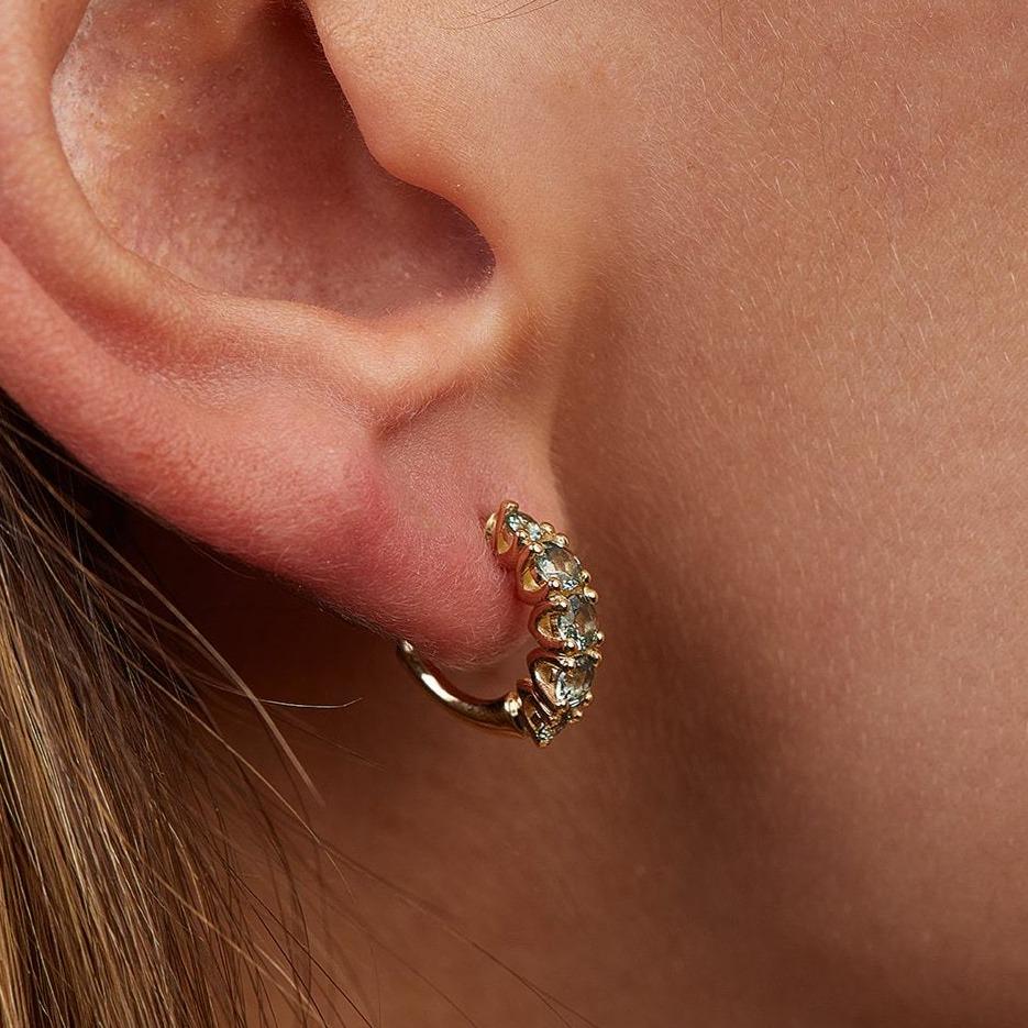 Olive tree earrings studded with light green sapphire