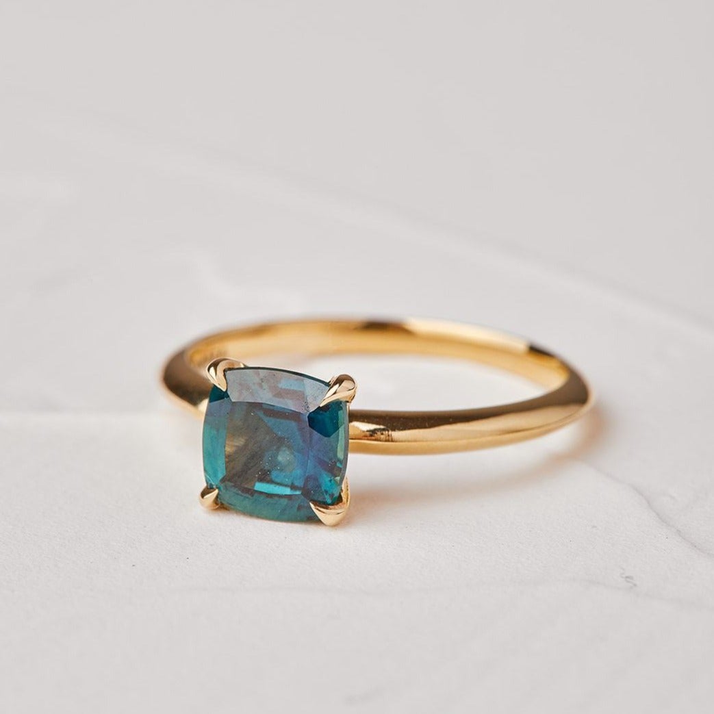With a sapphire stone and a gold hyacinth ring