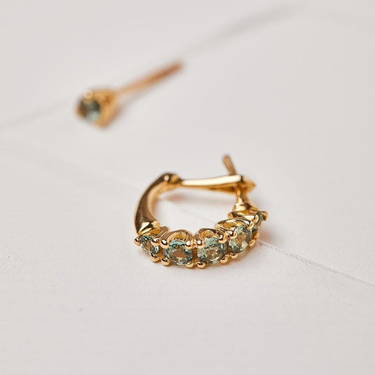 Olive tree earrings studded with light green sapphire